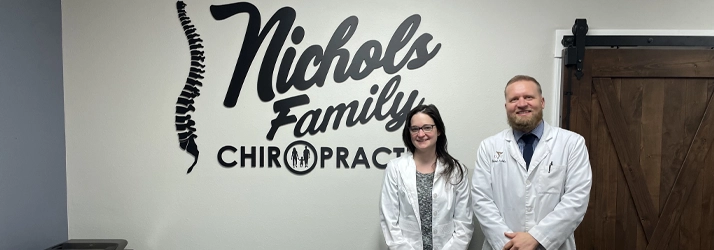 Chiropractor-Fargo-ND-Jared-Nichols-With-Staff-Member-Contact-Us.webp