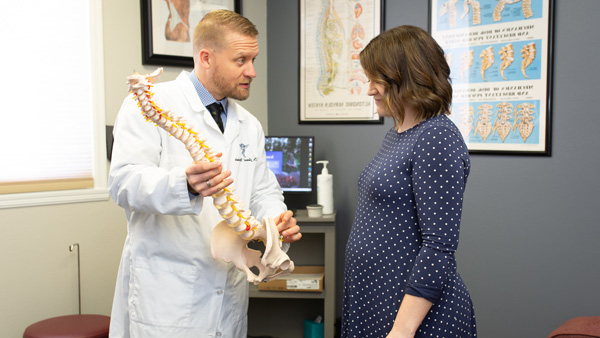 Chiropractor Fargo ND Jared Nichols With Patient